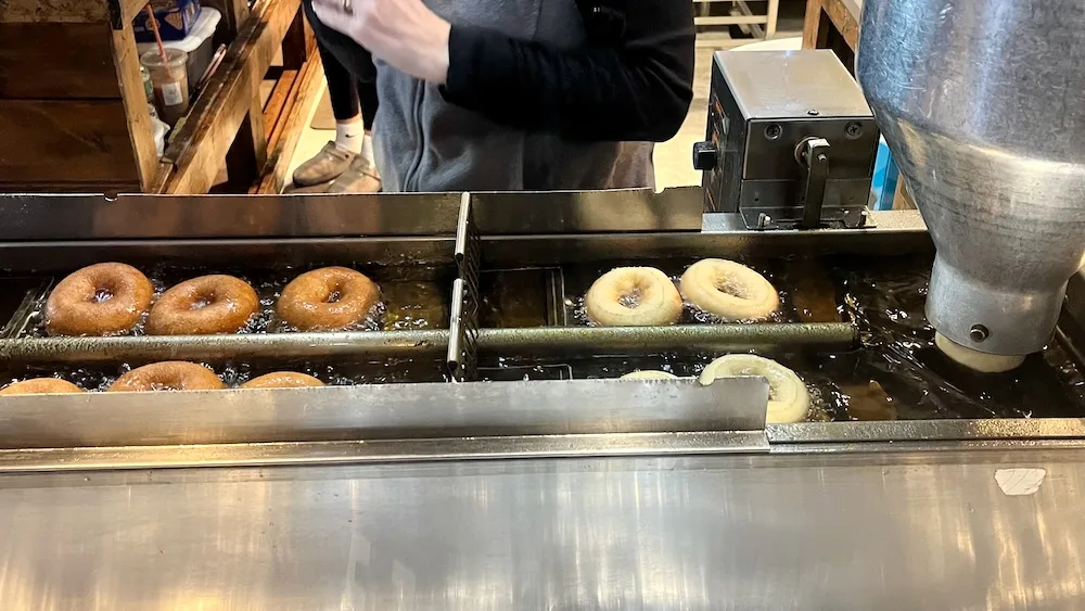 At glazed over in beacon, ny, you can watch your doughnut make its way through the fryer.