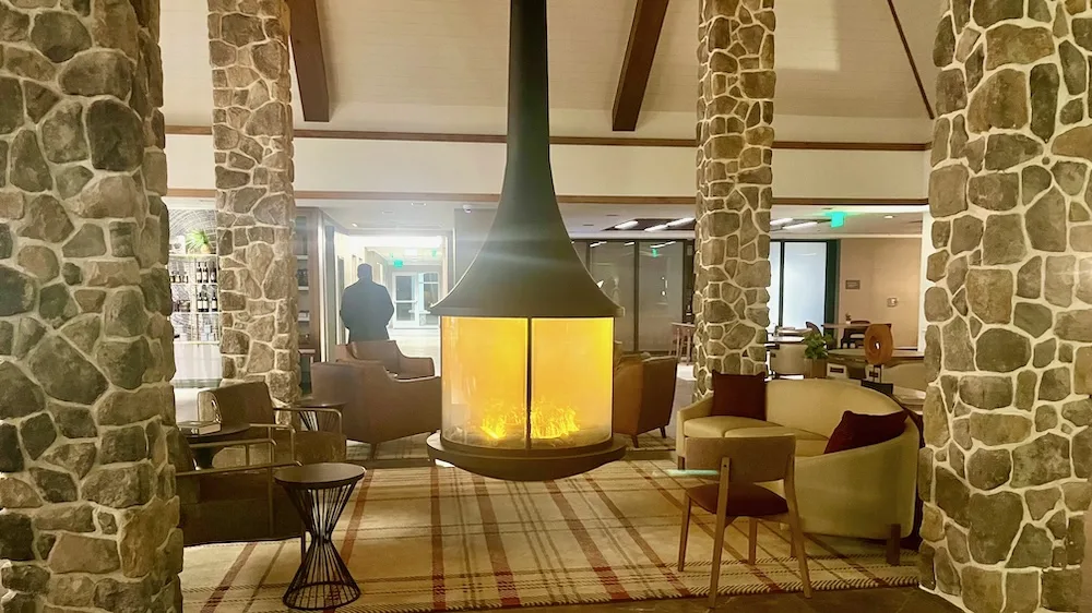 The unique hanging fireplace is the focal point of the lounge at the inn at bellefield in dutchess co. , ny