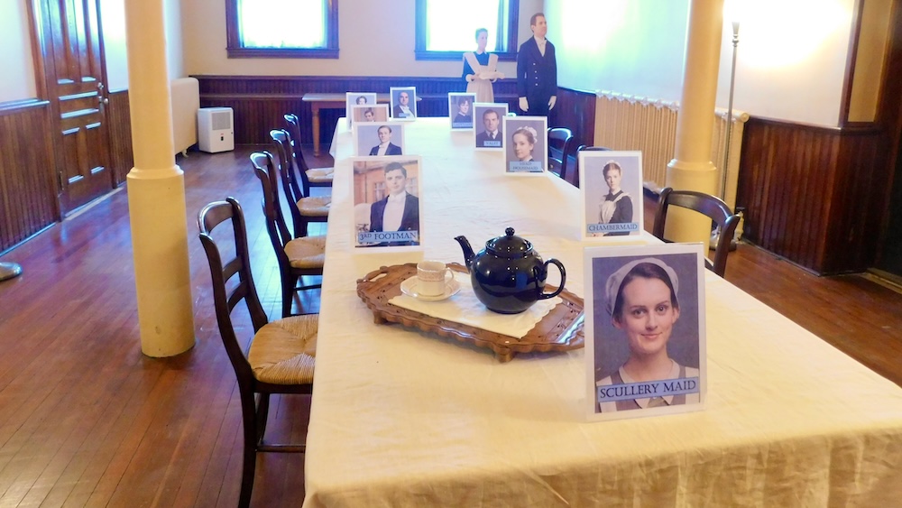 In the servants' hall at mills mansion, photos from downton abbey show where the characters' american counterparts sat at the staff table.