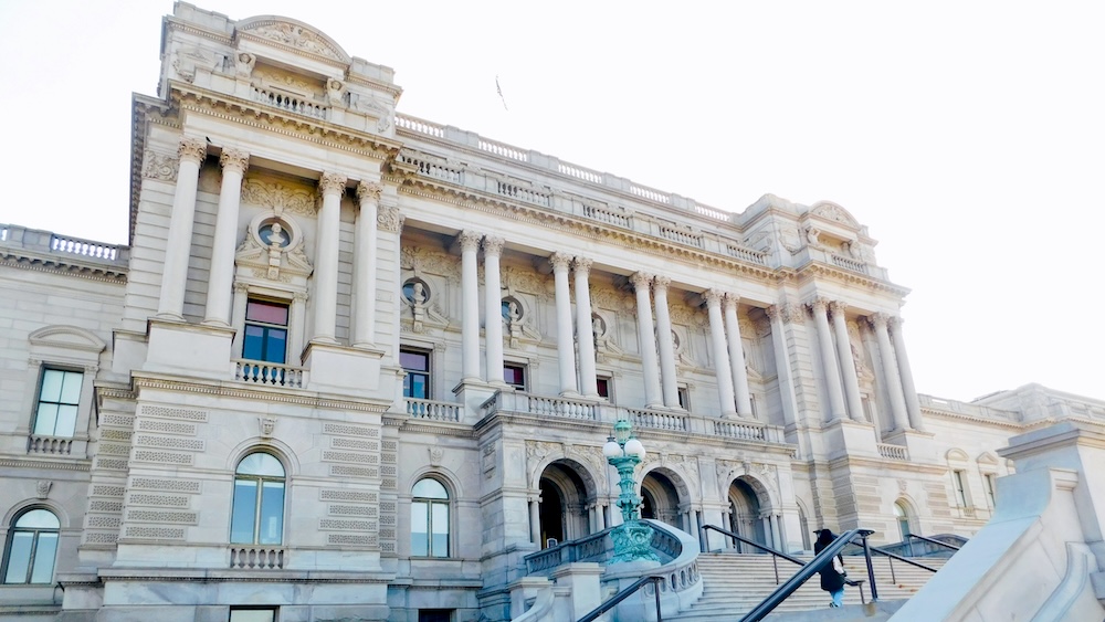 the neoclassical exterior and main staircase of the library of congress