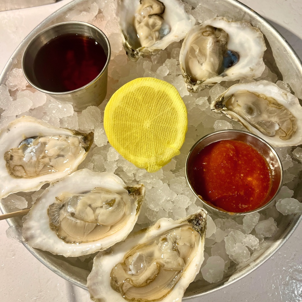 Roy oysters with sauces at zeke's in gulf shores.