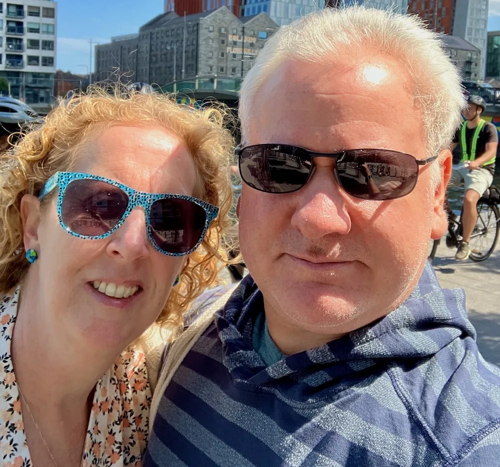 Rich and eileen from familiesgo! Pause in dublin's docklands neighborhood for a selfie on their couple weekend.