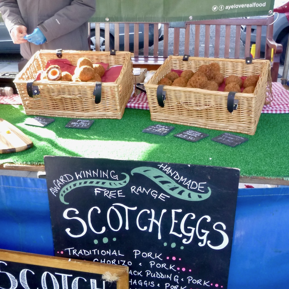 scotch eggs are one of many kid-friendly foods you'll find at the outdoor market next to edinburgh castle.