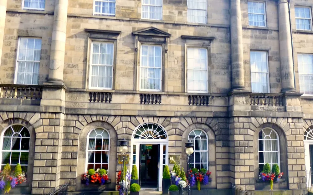 the townhouse entrance to the kimpton charlotte square hides a larger, family friendly hotel in edinburgh's new town.