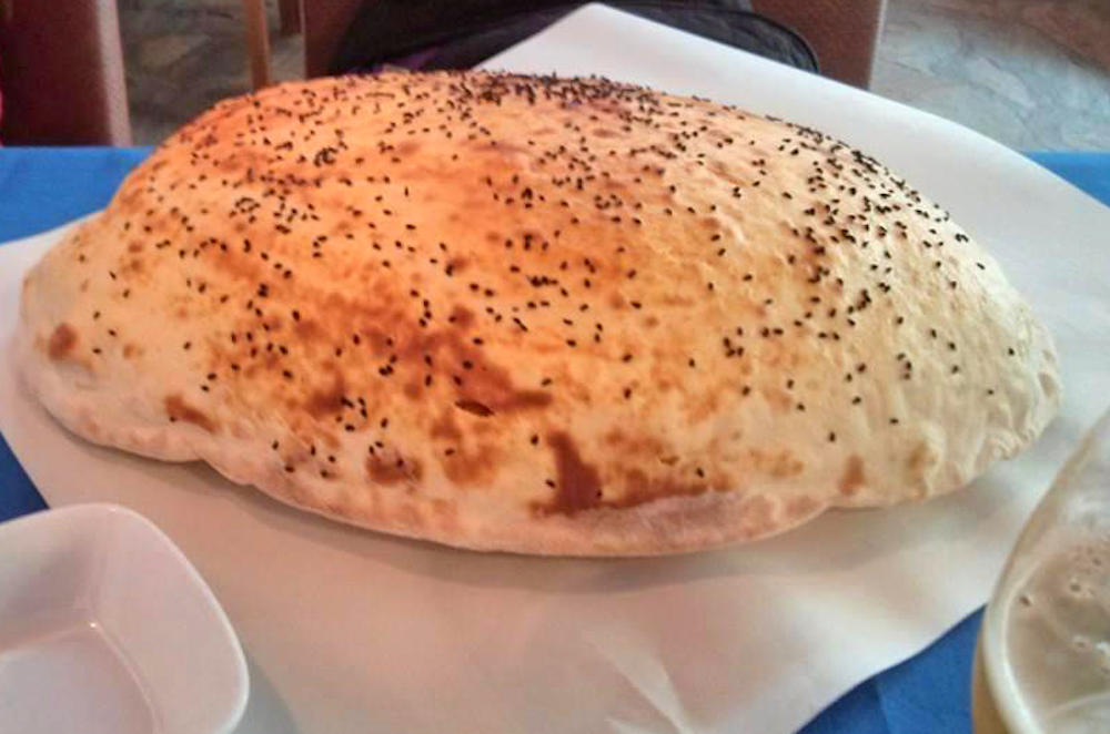in kusadasi, meals often include a puffed up lava bread with nigella or sesame seeds o top.