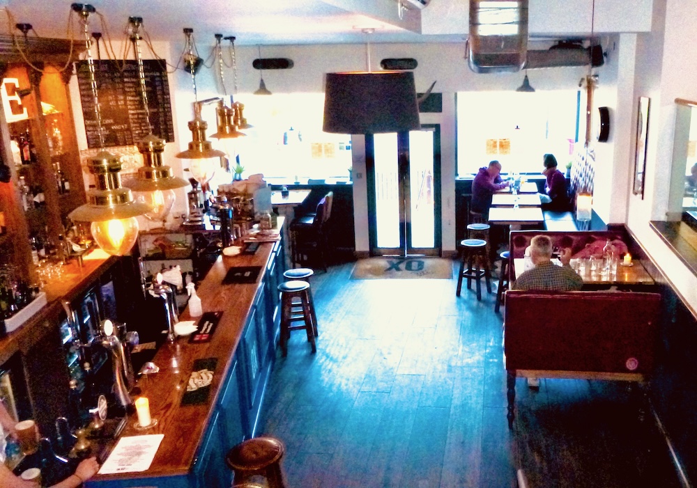 the ox pub has a cozy bar area where lucky diners can order sunday roast.