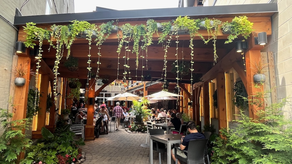 the shady, hidden patio of druthers brewing co on broadway in saratoga springs