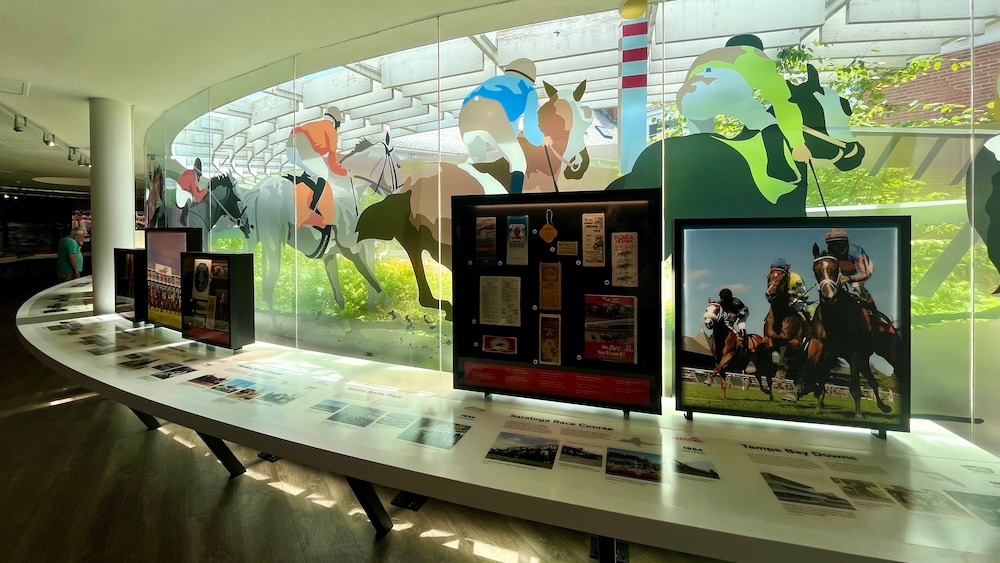 the national museum of racing in saratoga springs celebrates horse racing in the us with vibrant modern exhibits.