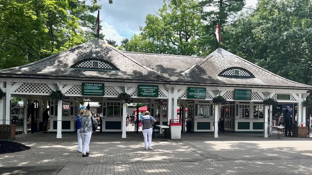 victorian-style wooden buildings greet visitors to saratoga race course, one of many unique things to do on a couple's weekend